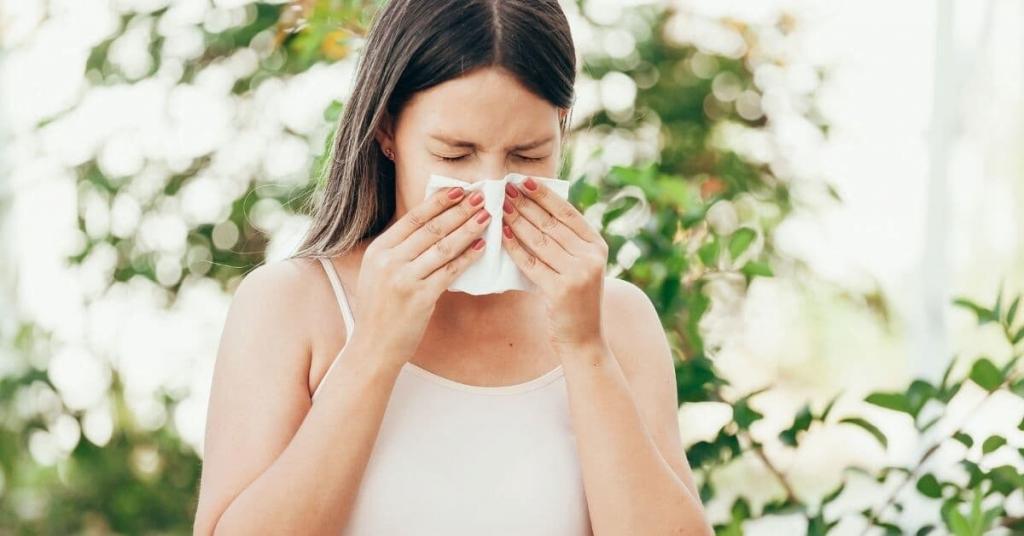 woman sneezing